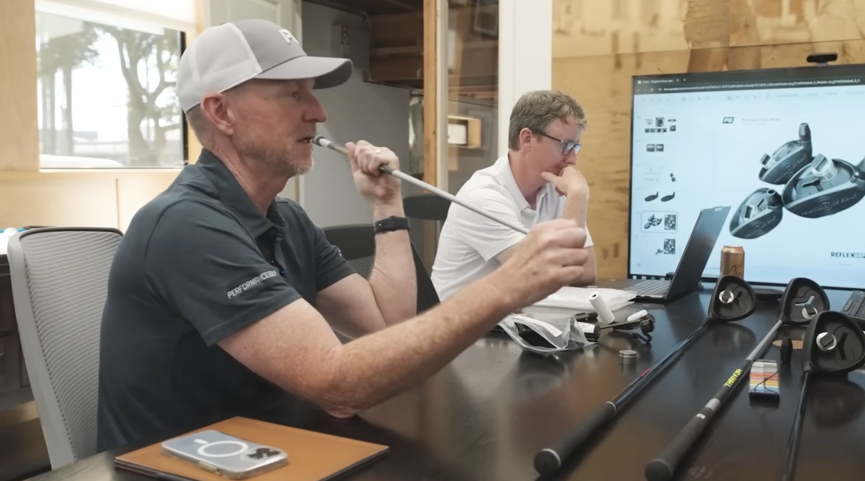 Performance Golf and ReflexGRP team reviewing golf club prototypes and CAD renderings in the studio